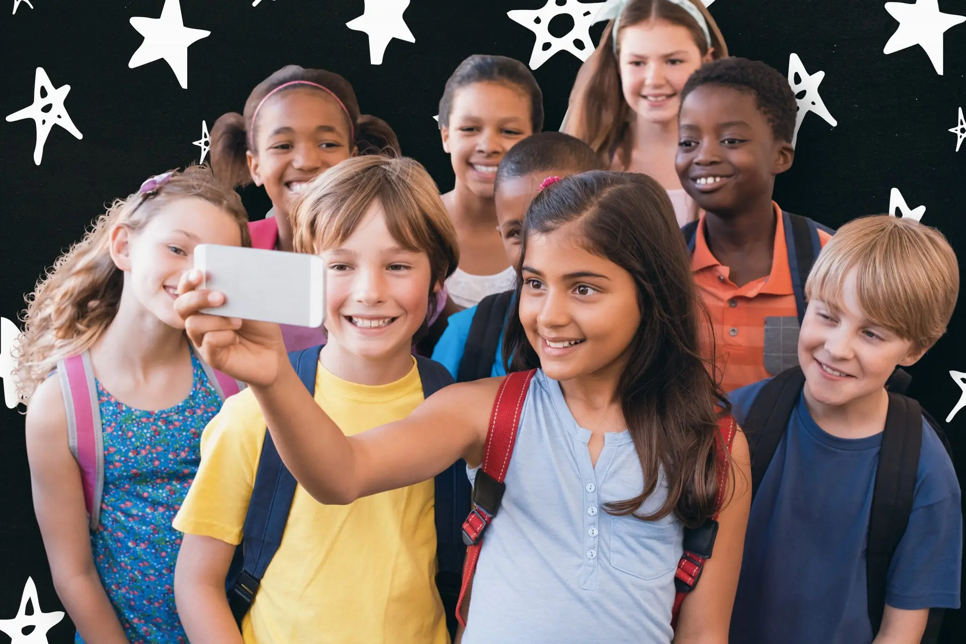 A group of diverse children, wearing colorful clothes and backpacks, eagerly gather as a girl in the front holds up a cell phone to snap a selfie. White star and doodle patterns adorn the dark backdrop, adding a whimsical touch to their cheerful moment together.