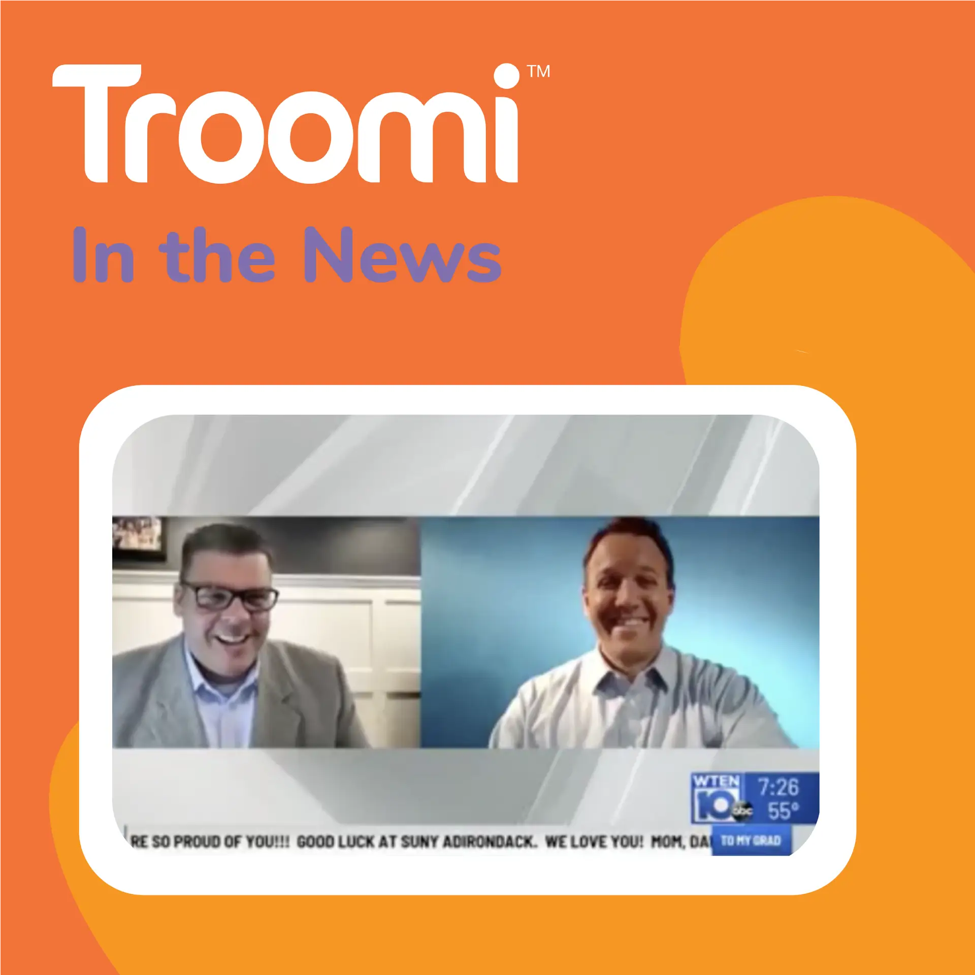 Two men in suits are on a video call, smiling. The screen features Troomi In the News on an orange background, highlighting their innovative phone that adjusts to your family’s needs. Below, a news ticker scrolls with congratulatory messages, celebrating this technological advancement.