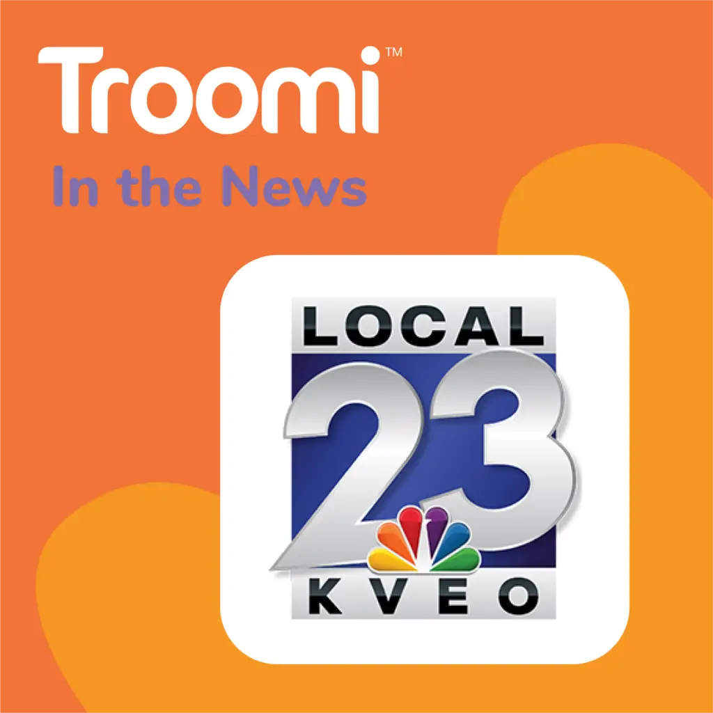 Orange background with "Troomi In the News" text at the top. Below, a white square displays the Local 23 KVEO logo, featuring the numbers 23 and NBC peacock. Highlighting a phone that adjusts to your family's needs seamlessly fits within this innovative news segment.