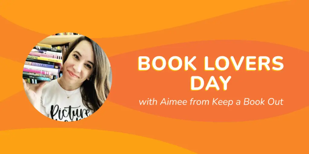 A woman, enriched by a stack of books, smiles warmly at the camera. "Celebrate Book Lovers Day with Aimee from Keep a Book Out," reads the text on an orange background adorned with wavy patterns, inviting you to dive into a world of stories.