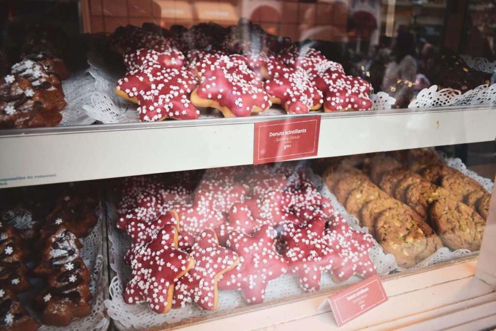 red star donuts with white sprinkles in a bakery