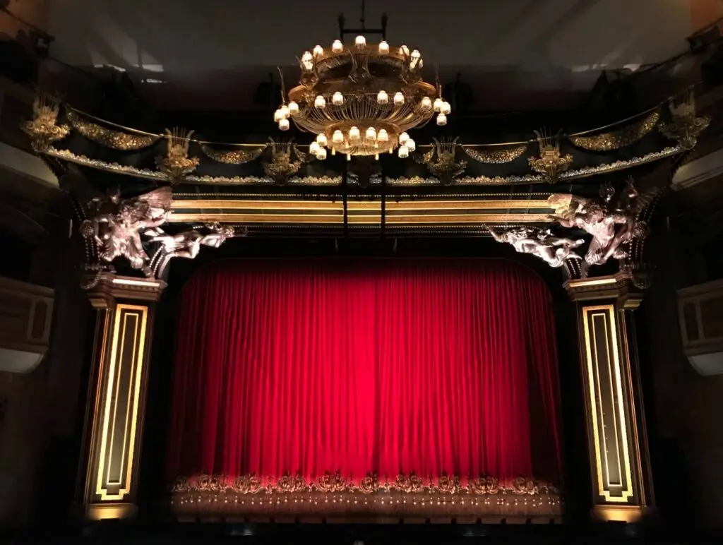 empty theater stage with red curtains