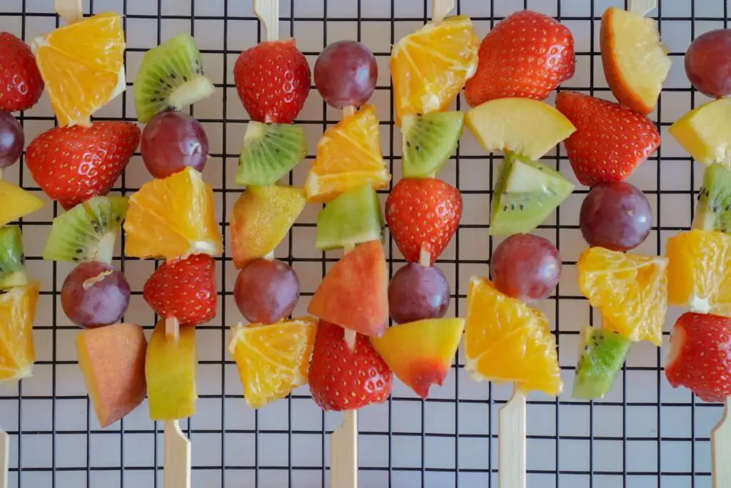 a row of fruit kabobs