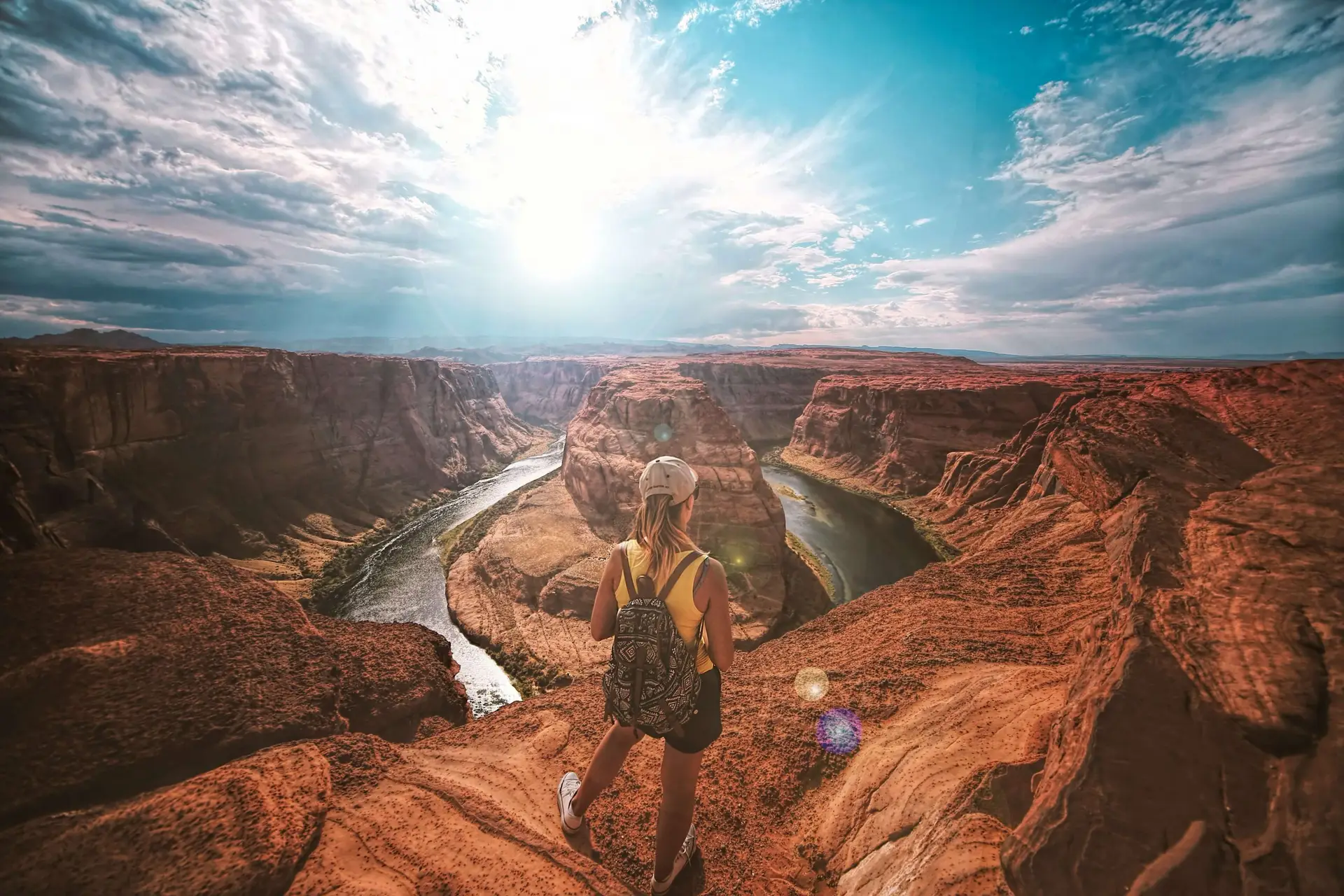 woman exploring at the top of a canyon