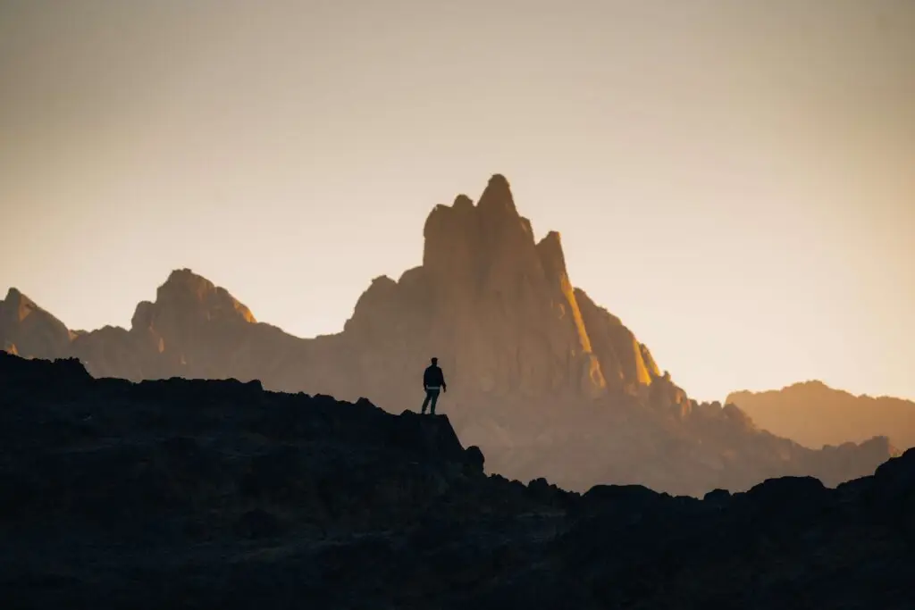 person looking out at mountains