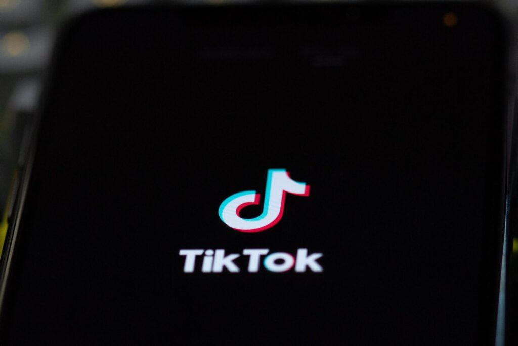 close of up of phone with tik tok logo on the screen