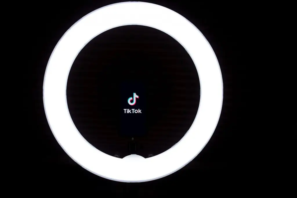 ring light with phone in it showing the tiktok icon on the screen