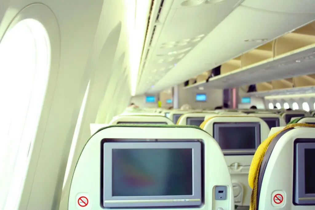 screens on the back of seats on an airplane