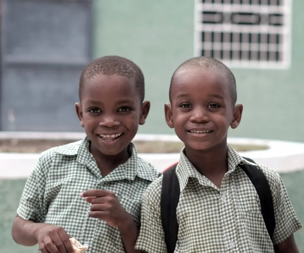 two little boys with green plaid shirts on