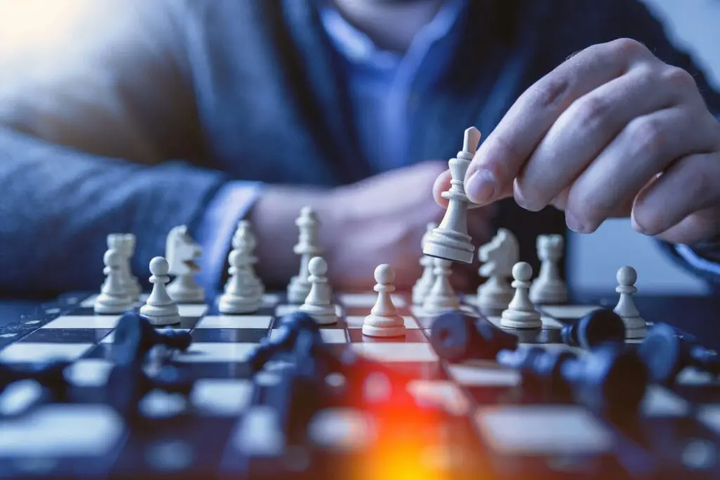 close up of man playing chess