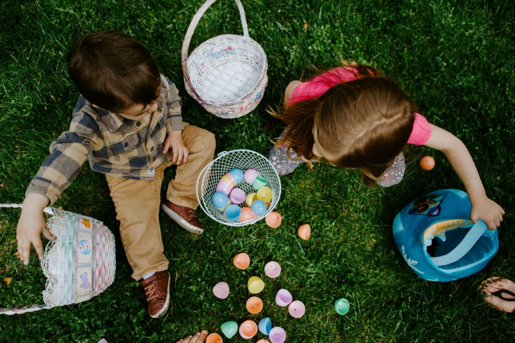 boy and girl with their easter baskets and eggs