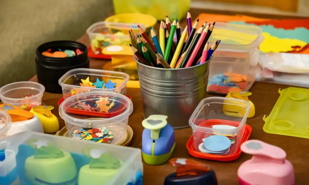 colored pencils next to arts and crafts materials