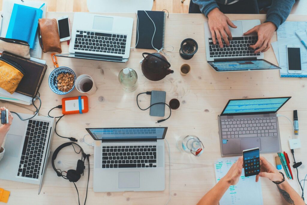 people working on their computers together