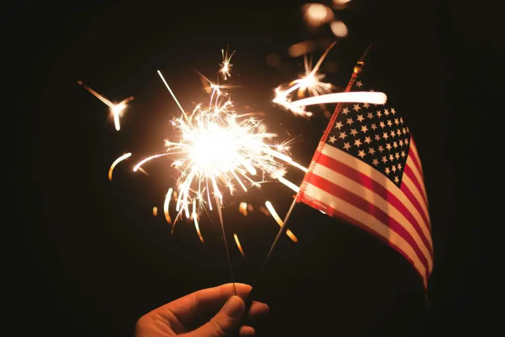 mini american flag next to sparkler