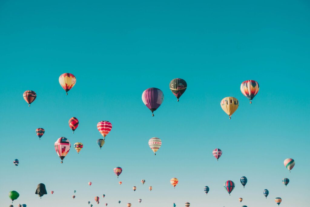 group of hot air balloons in the sky