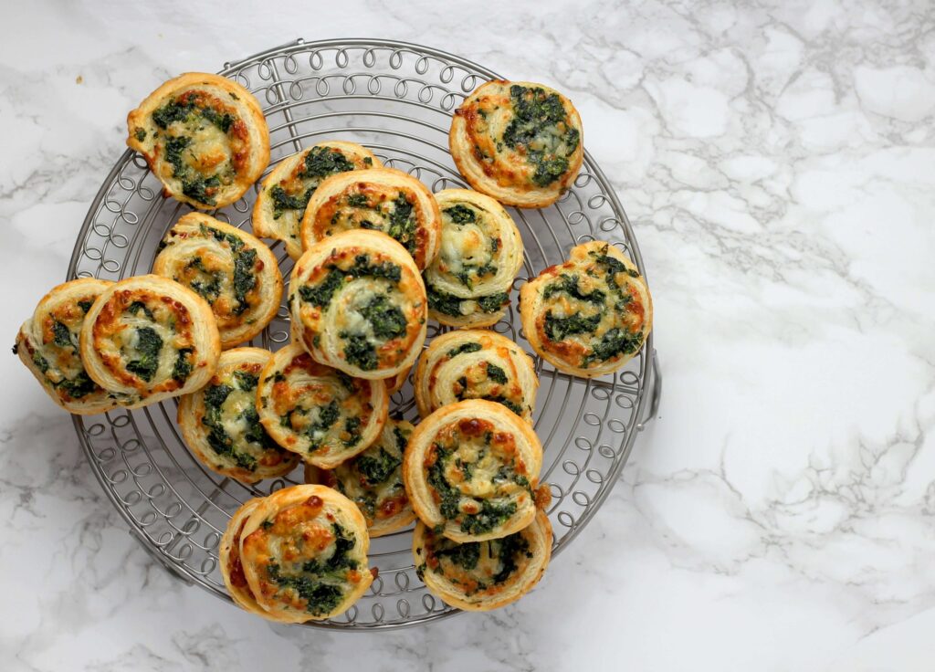 mini spinach and cheese croissants on platter