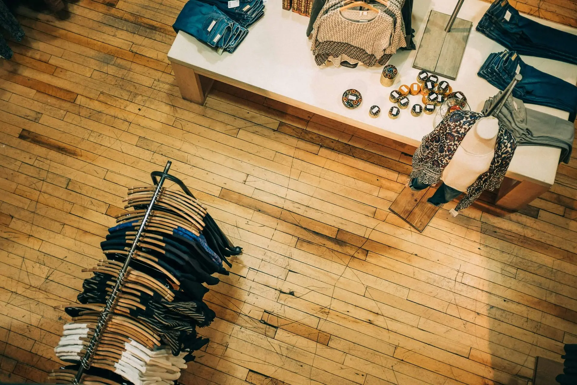 clothing store with clothes on the rack and table