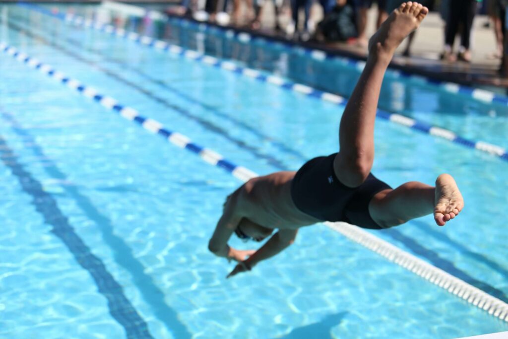 kid diving into swimming pool