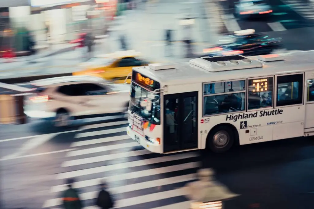 bus driving through traffic