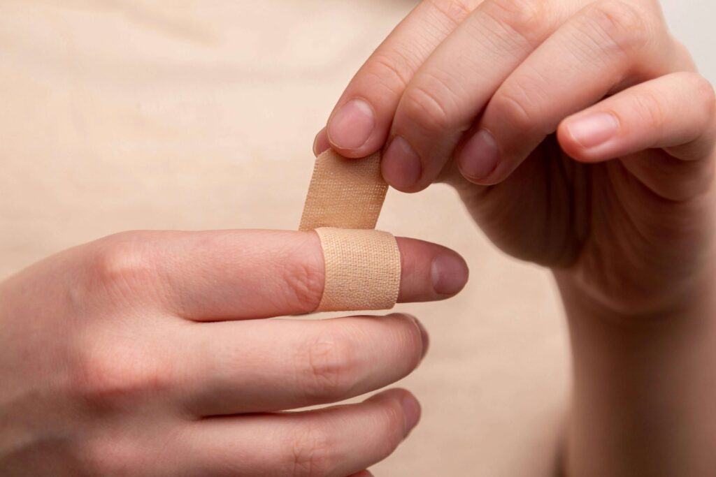 putting a bandaid on your finger