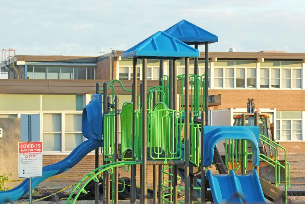 green and blue playground with slides