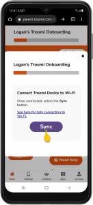 A smartphone screen displays a Troomi onboarding process. The screen shows a prompt to connect the device to Wi-Fi. A purple Sync button is highlighted with a yellow arrow. The process bar is partially filled at the top.