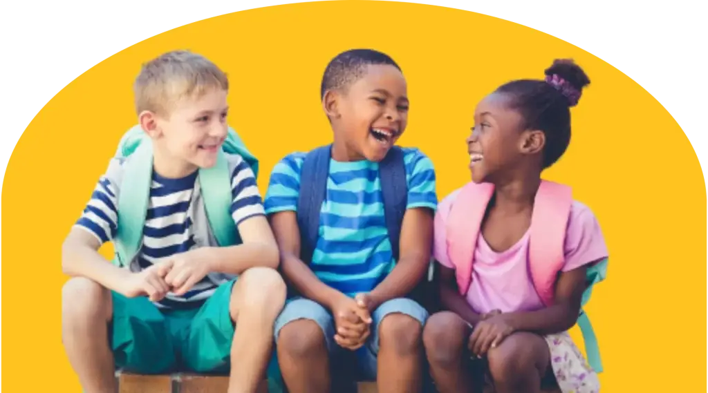 Three children are sitting and laughing together, wearing backpacks. They are dressed in colorful summer clothes against a bright yellow background. The setting suggests a playful and cheerful mood, possibly before or after school.