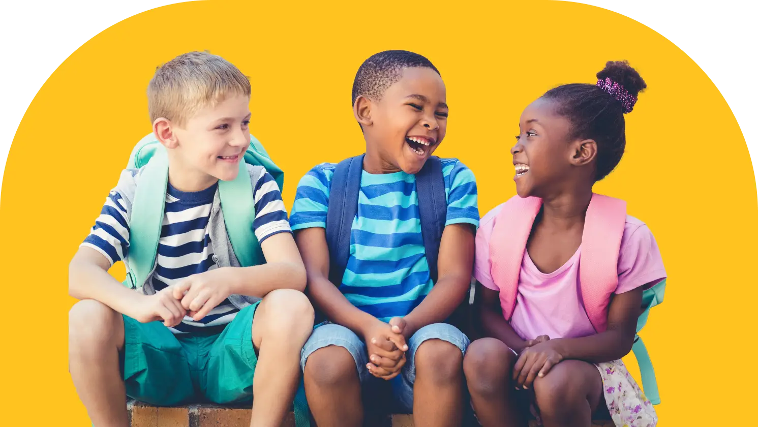 Three children sitting and laughing, wearing casual summer clothes and backpacks. They are sitting against a bright yellow background, enjoying a cheerful moment together.