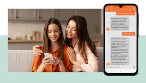 A woman and a teenage girl sit on a couch, smiling while looking at a smartphone. Next to them is a mock-up image of a mobile phone screen using Troodi AI to enhance their text conversation about improving cheerleading skills.