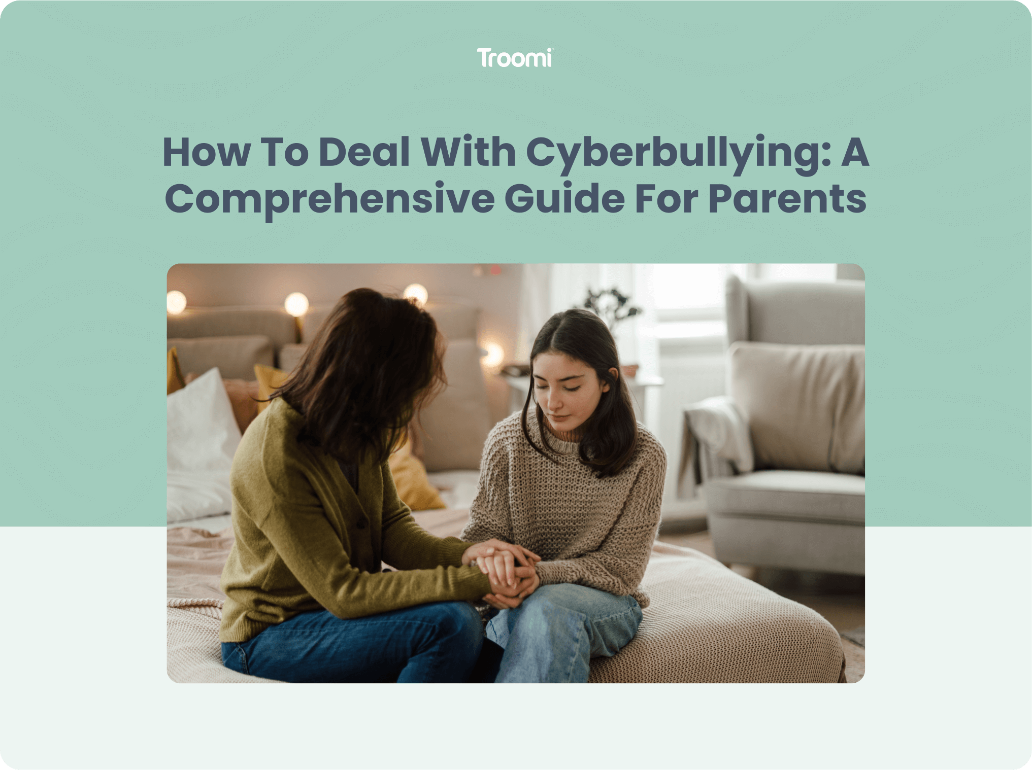 A mother and daughter sit on a bed, holding hands and talking seriously. The room is softly lit, with cushions and a lamp in the background. The text above them reads, How To Deal With Cyberbullying: A Comprehensive Guide For Parents.