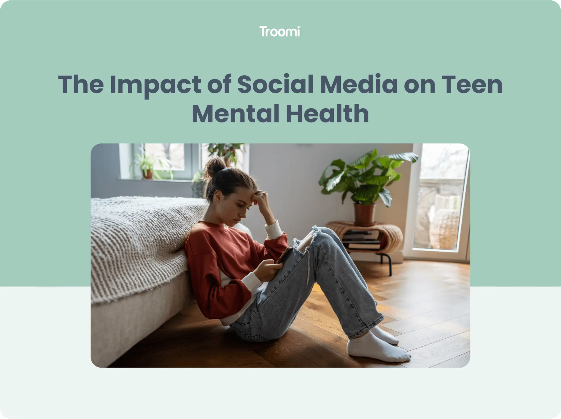 A young woman sits on the floor next to a bed, looking at her phone with a thoughtful expression. She is in a cozy room with plants and a large window. The image has a banner that reads, The Impact of Social Media on Teen Mental Health.