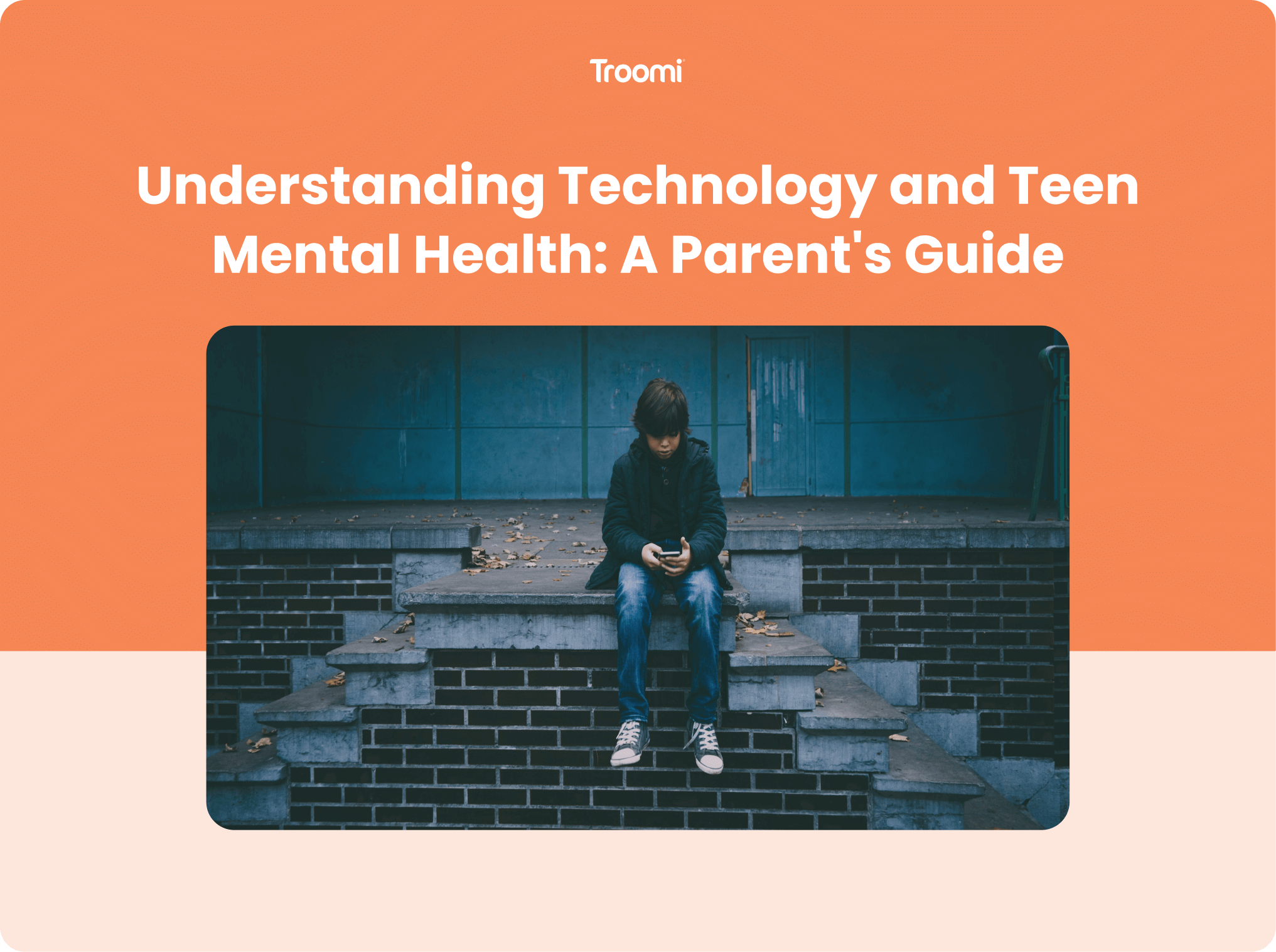 A teenager sits alone on concrete steps, looking at their phone. The background is a dimly lit urban setting. The orange and beige top half of the image displays the text: Understanding Technology and Teen Mental Health: A Parents Guide by Troomi.