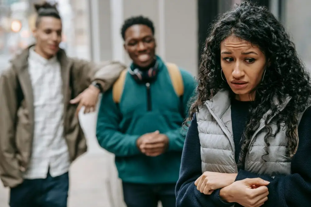 Teen students bullying another student.