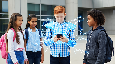 Four kids stand outside a building. The boy in the center, holding a smartphone, is surrounded by blue, glowing, animated electricity lines. The others watch him with interest. All are wearing casual clothes and backpacks.