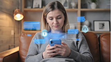 A woman sits on a brown leather couch using her smartphone, with digital blue security and chat icons superimposed, suggesting online communication and data protection.